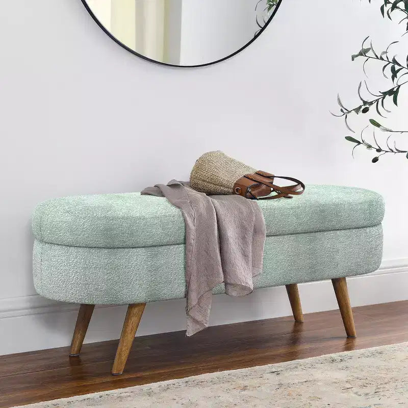 Banc de rangement ottoman ovale en tissu avec pieds en bois d'hévéa