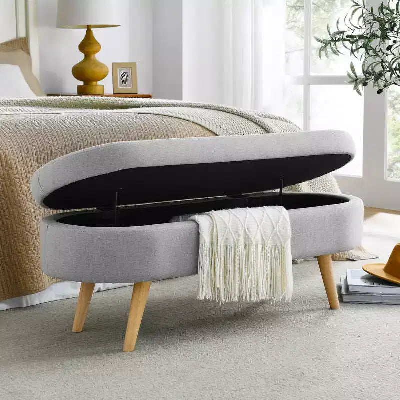 Banc de rangement ottoman ovale en tissu avec pieds en bois d'hévéa