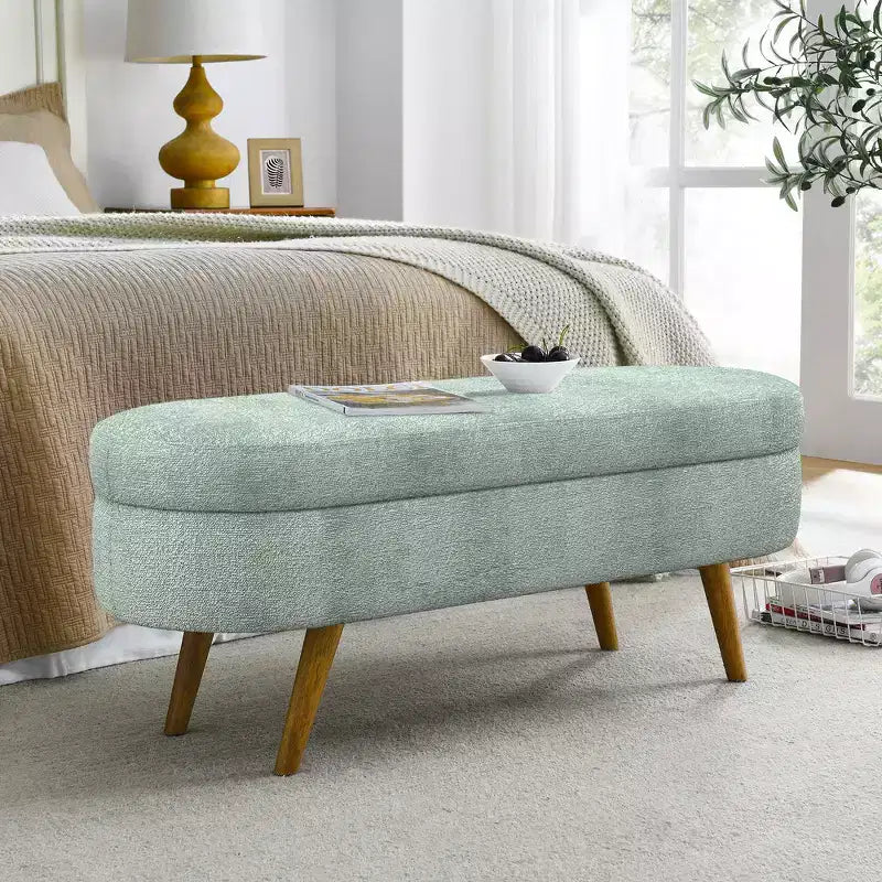 Banc de rangement ottoman ovale en tissu avec pieds en bois d'hévéa
