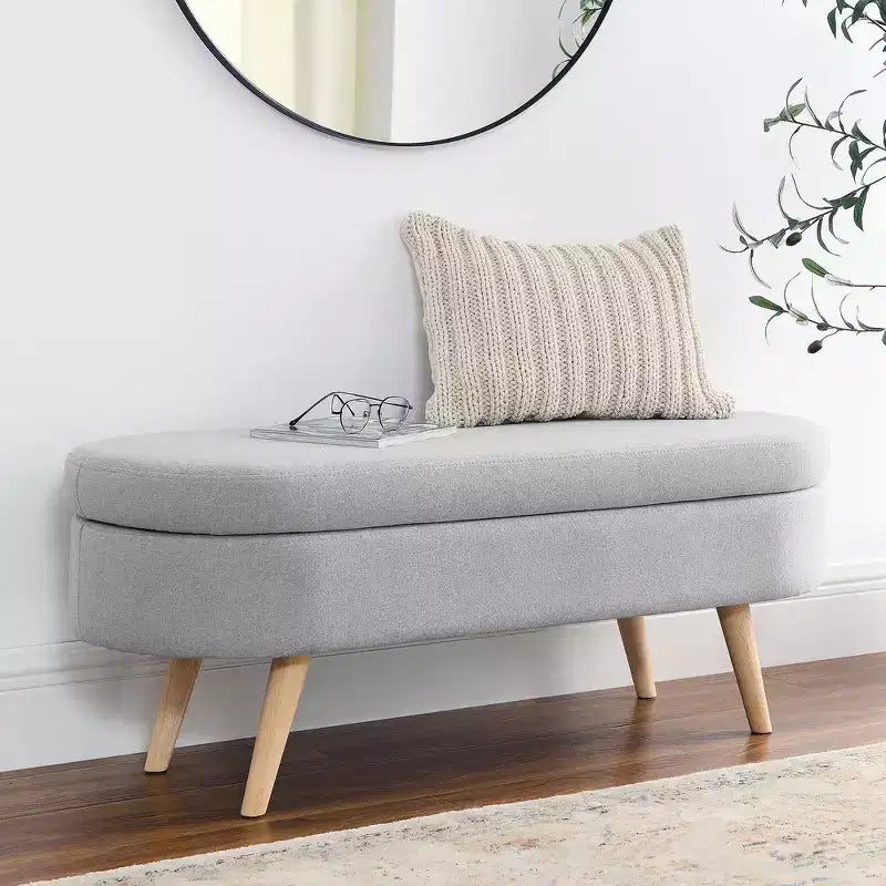 Banc de rangement ottoman ovale en tissu avec pieds en bois d'hévéa