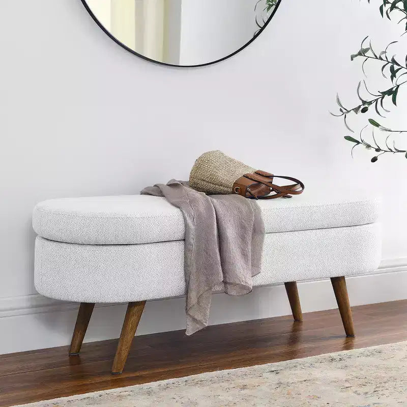Banc de rangement ottoman ovale en tissu avec pieds en bois d'hévéa